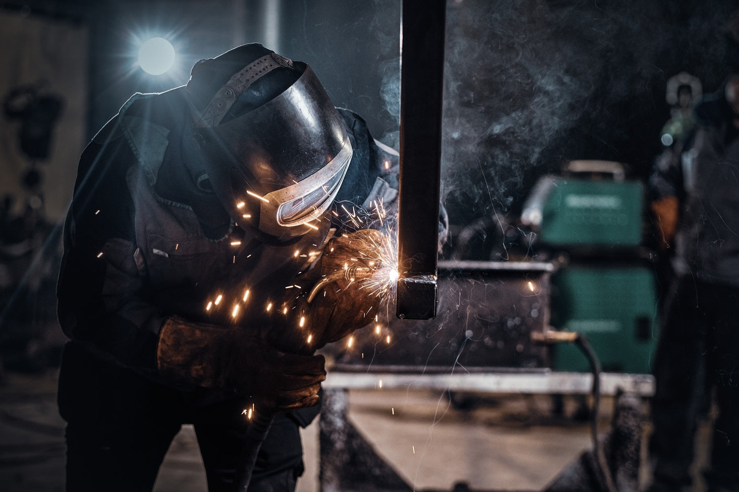 Person wielding in a metal workshop